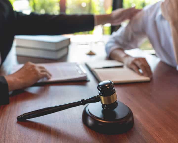 professional lawyer discussing legal options and solutions with a client in Winston Salem, NC
